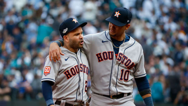 Jose Altuve talks with Astros teammate Yuli Gurriel